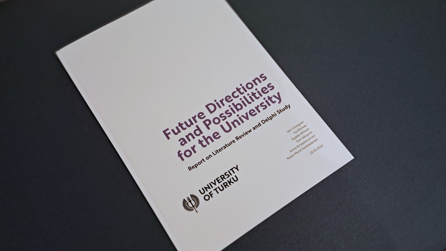 Printed version of the Future Directions and Possibilities for the University report with a white cover.