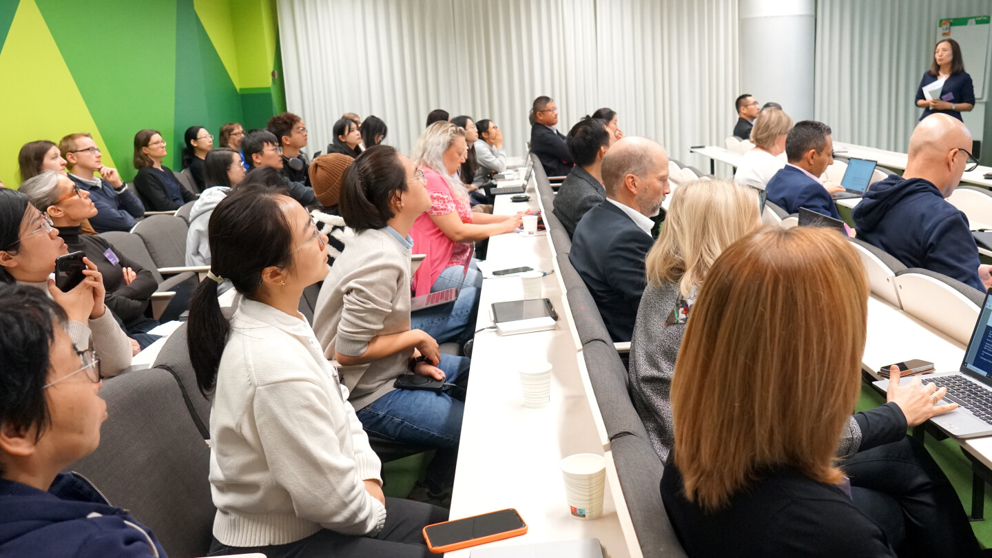 Participants sitting in a lecture room.