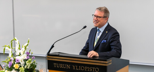 Rector Jukka Kola speaking at the event.