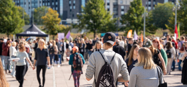 People gathered at the Opening Carnival 2024 at the sunny square between Educarium and Publicum.