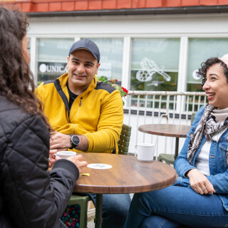 three students sitting at a table